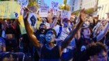 Demonstrators protest, Thursday, June 4, 2020, near the White House in Washington, over the death of George Floyd, a black man who was in police custody in Minneapolis. Floyd died after being restrained by Minneapolis police officers.