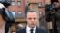 FILE - Oscar Pistorius leaves the high court in Pretoria, South Africa. 