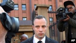 FILE - Oscar Pistorius leaves the high court in Pretoria, South Africa. 