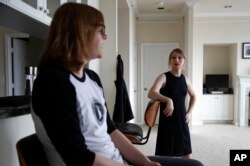 Chelsea Manning, right, chats with Kelly Wright, communications director for Manning's senatorial campaign, in Manning's apartment in North Bethesda, Maryland, April 24, 2018.