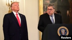FILE - U.S. President Donald Trump and Attorney General William Barr participate in a ceremony in the East Room of the White House in Washington, Sept. 9, 2019.