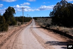 The dirt road that leads to the Pinyon Plain Uranium mine is shown on Wednesday, Jan. 31, 2024, near Tusayan, Ariz. The largest uranium producer in the US has ramped up work on a long-contested project that largely has sat dormant since the 1980s.