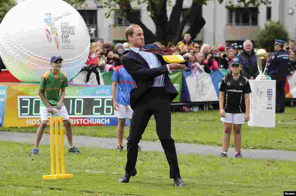Britain&#39;s Prince William hits a ball using a cricket bat while attending a promotional event for the upcoming Cricket World Cup in Christchurch, New Zealand.