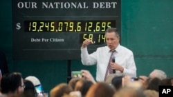 FILE - Ohio Gov. John Kasich talks about the national debt at Mohawk Valley Community College in Utica, N.Y., in his bid for the 2016 Republican presidential nomination, April 15, 2016.