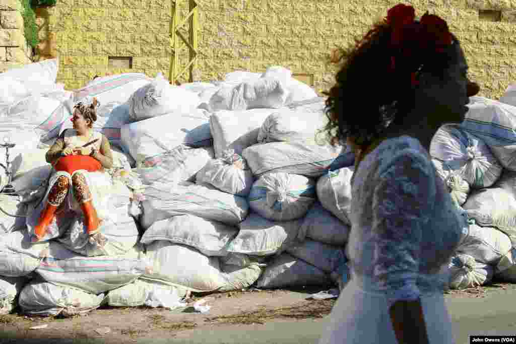 Sabine Choucair, right, founded Clown Me In and is the only professional clown among the troupe, which includes Sara Berjawi, left. Choucair also works with Clowns Without Borders and has traveled the world putting her clowning skills to use. 