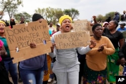 Relatives and friends protest near a gold mineshaft where illegal miners are trapped in Stilfontein, South Africa, on Nov. 15, 2024.