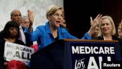 FILE - Senator Elizabeth Warren speaks about "Medicare for All" on Capitol Hill in Washington, Sept. 13, 2017. 