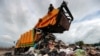 FILE - A person works in a landfill in Phuket, Thailand, Nov. 22, 2024. 