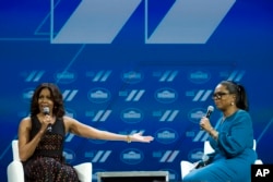 First lady Michelle Obama and Oprah Winfrey have a discussion on Trailblazing the Path for the Next Generation of Women during the White House Summit on the United State of Women in Washington, June 14, 2016.