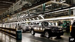 FILE - SUV'S near the final process on the assembly line at the General Motors plant in Arlington, Texas, July 14, 2015. 