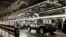 FILE - SUV'S near the final process on the assembly line at the General Motors plant in Arlington, Texas, July 14, 2015. 