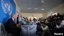 The United Nations Special Rapporteur for human rights in Cambodia, Surya Subedi, reads from a document during a news conference in central Phnom Penh January 16, 2014. Subedi spoke on ongoing political crisis in Cambodia and said that political reconciliation is the only way forward for the country.