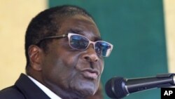 Zimbabwe's President Robert Mugabe speaks during a visit to Mimosa Platinum mine about 400km (249 miles) south of the capital Harare, February 16, 2012.