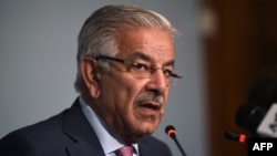 Pakistani Foreign Minister Khawaja Asif briefs the media at the end of a three-day conference in Islamabad, Pakistan, Sep. 7, 2017. Asif says the war on terror “cannot be won by excluding or confronting” Islamabad.