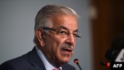 FILE - Pakistani Foreign Minister Khawaja Asif briefs reporters at the end of conference in Islamabad, Sep. 7, 2017.