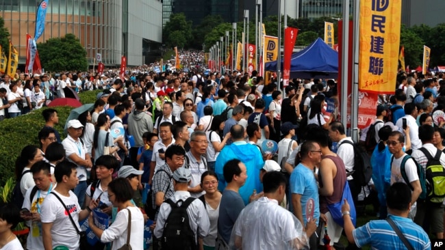 Pro-China supporters gather at a park during a counter-rally in support of the police in Hong Kong Saturday, July 20, 2019. (AP Photo/Vincent Yu)