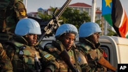 FILE - U.N. peacekeepers wait to escort members of the U.N. Security Council as they arrive at the airport in Juba, South Sudan, Sept. 2, 2016. One South Sudanese lawmaker says a regional protection force will need to be better armed than the current peacekeeping force in the country.