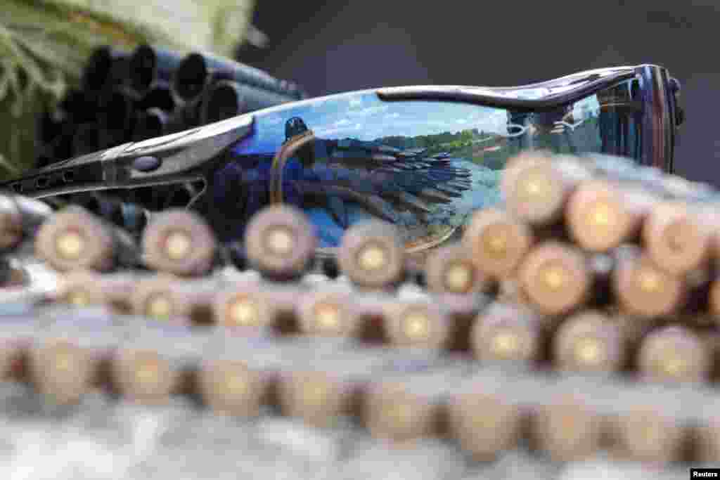 Ammunition and sunglasses are placed on a stone at a checkpoint controlled by the Ukrainian army near the town of Debaltseve, Donetsk Region.