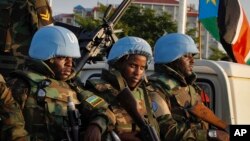 FILE -- U.N. peacekeepers from Rwanda wait to escort members of the U.N. Security Council as they arrive at the airport in Juba, South Sudan, Sept. 2, 2016. The envoys arrived Friday to press the government to allow another 4,000 peacekeepers into South Sudan. 