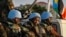 FILE - U.N. peacekeepers wait to escort members of the U.N. Security Council as they arrive at the airport in Juba, South Sudan, Sept. 2, 2016. One South Sudanese lawmaker says a regional protection force will need to be better armed than the current peacekeeping force in the country.