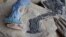 A fossil of Atopodentatus unicus is seen alongside a reconstruction showing what it would have looked like in life is shown in this image released May 6, 2016. (Courtesy: Nick Fraser/National Museums Scotland) 