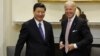 FILE - Joe Biden and China's Xi Jinping are pictured in the Roosevelt Room at the White House in Washington, Feb. 14, 2012, when each was his nation's vice president.