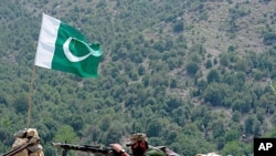 A Pakistani soldier is pictured on Manatu mountain in Kurram Agency, Pakistan's tribal belt bordering Afghanistan, during an operation against militants on July 10, 2011.