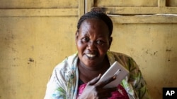 Rhoda Fresa doesn't want to sign up for South Sudan's own mobile money service because everyone she knows has already fled the country to Uganda.