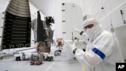 Principal Investigator for NASA's Lucy spacecraft, Hal Levison, speaks with a reporter at the AstroTech facility Wednesday, Sept. 29, 2021, in Titusville, Fla. (AP Photo/John Raoux)