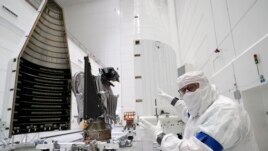 Principal Investigator for NASA's Lucy spacecraft, Hal Levison, speaks with a reporter at the AstroTech facility Wednesday, Sept. 29, 2021, in Titusville, Fla. (AP Photo/John Raoux)