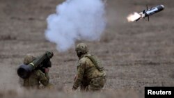 Australian Army soldiers fire a Javelin anti-tank missile during Excercise Chong Ju, a live fire demonstration showcasing the army's joint combined arms capabilities at the Puckapunyal Military Base near Melbourne on May 9, 2019. 