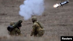 Australian Army soldiers fire a Javelin anti-tank missile during Excercise Chong Ju, a live fire demonstration showcasing the army's joint combined arms capabilities at the Puckapunyal Military Base near Melbourne on May 9, 2019. 