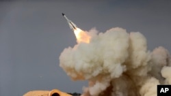 FILE - A long-range S-200 missile is fired in a military drill in the port city of Bushehr, on the northern coast of Persian Gulf, Iran, Dec. 29, 2016.