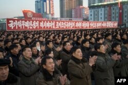 FILE - North Koreans attend a mass rally to celebrate the North's declaration it had achieved full nuclear statehood, on Kim Il-Sung Square in Pyongyang, Dec. 1, 2017.