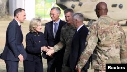 U.S. Defense Secretary James Mattis, second from right, and NATO Secretary General Jens Stoltenberg, center, are welcomed by U.S. General John Nicholson after arriving at Resolute Support Mission headquarters in Kabul, Afghanistan, Sept. 27, 2017. 