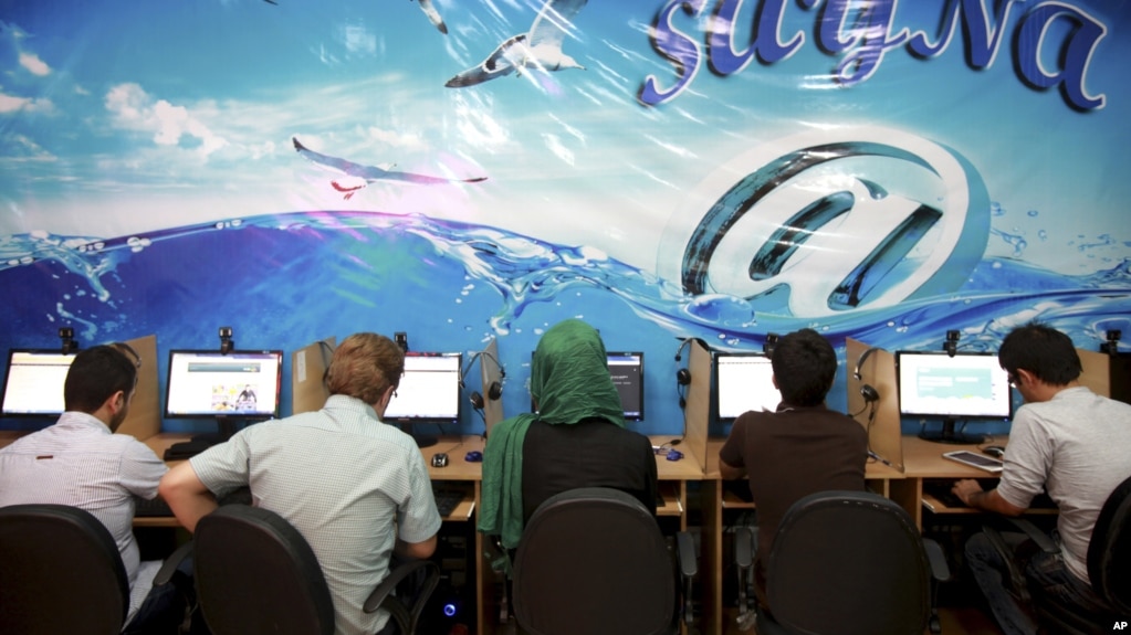 Iranians surf the internet at a cafe in Tehran, Iran, Sept, 17, 2013. In Iran, a government push for a 'halal' internet means more control after protests.