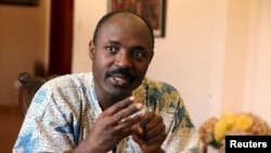 FILE - Journalist Rafael Marques is interviewed at his home in Luanda, Angola, May 12, 2015. 