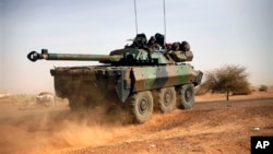 A French tank is seen heading north at the tail end of military convoy in Gao, northern Mali, Feb. 6, 2013.