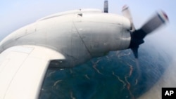 The Deep Water Horizon oil slick, seen from the window of the Lockheed WP-3D Orion aircraft.