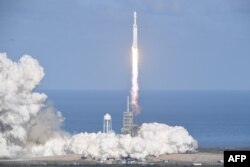 The SpaceX Falcon Heavy takes off from Pad 39A at the Kennedy Space Center in Florida, Feb. 6, 2018, on its demonstration mission.