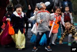 Children celebrating Halloween in China.