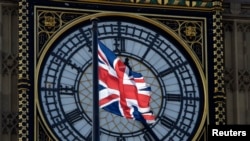 FILE - A Union flag flies in front of the Big Ben clock face abover the Houses of Parliament in central London, Britain, April 18, 2017. 