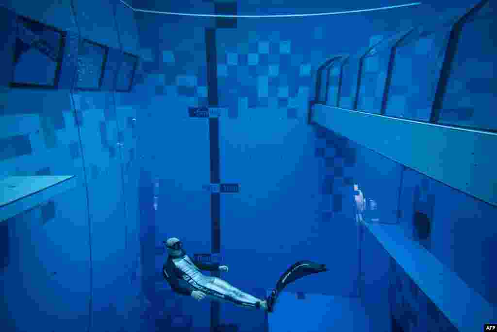 A diver is seen in the deepest pool in the world with 45.5-meter (150-foot) located in Mszczonow about 50 km from Warsaw, Poland, Nov. 21, 2020.