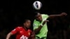Manchester United's Patrice Evra (L) challenges Aston Villa's Christian Benteke during their English Premier League soccer match at Old Trafford in Manchester, northern England, April 22, 2013.