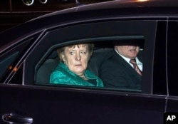 Chairwoman of the Christian Democratic Union and German Chancellor Angela Merkel and Bavaria's Prime Minister Horst Seehofer of Christian Social Union, arrive for a meeting with German President Frank-Walter Steinmeier at Bellevue Palace in Berlin, Germany, Nov. 30, 2017.