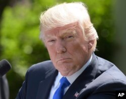 President Donald Trump listens during a news conference with Romania's President Klaus Werner Iohannis in the Rose Garden of the White House in Washington, June 9, 2017.