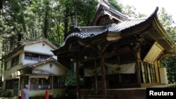 Buddhist monk Benmou Suzuki looks at the Mikaboyama Fudoson temple in Fujioka, Gunma prefecture, Japan, Sept. 4, 2024.