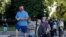People, practicing social distancing, wait in line to cast their vote in presidential elections, in Warsaw, Poland, June 28, 2020. 