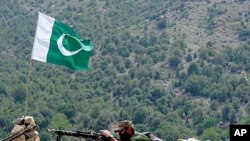 A Pakistani soldier is pictured on Manatu mountain in Kurram Agency, Pakistan's tribal belt bordering Afghanistan, during an operation against militants on July 10, 2011.