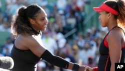 FILE - Naomi Osaka, right, of Japan, shakes hands with Serena Williams after winning their match at the Miami Open tennis tournament, Wednesday, March 21, 2018, in Key Biscayne, Fla. Osaka won 6-3, 6-2. The two will meet again in the 2018 U.S. Open Championship final. (AP Photo/Lynne Sladky)